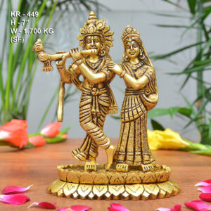 Brass Krishna Idol placed in a traditional home temple with spiritual décor