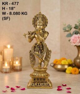 Brass Krishna Idol placed in a traditional home temple with spiritual décor